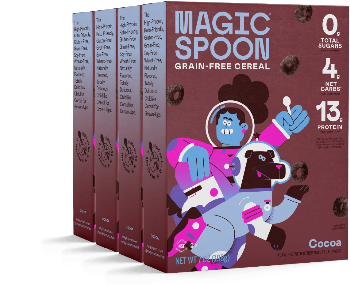 Four boxes of Magic Spoon Cocoa cereal with an astronaut character
